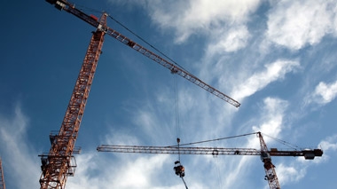 looking up a cranes and the open sky